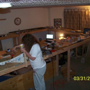 Part 1 of the layout as she stands now (yes that is my wife doing scenery