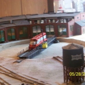 An incomplete FRISCO GP-40 sits on the turntable. The roundhouse is missing some of its roof. But this scene is just to show what has been done so far
