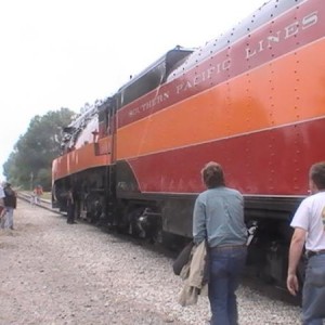 Fireman Jack Wellahan attends to the Valve Gear of 4449 as the passengers and onlookers take footage and video of 4449.