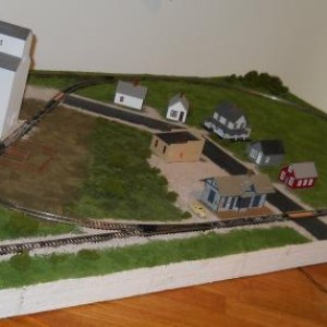 This is how the layout looks with all structures in place and the first detail, the car by the depot, set down