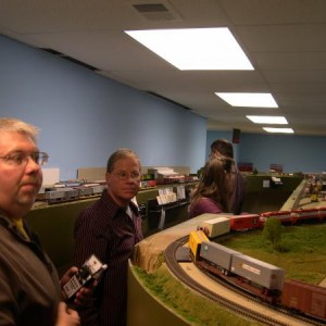 Bruce at the throttle of a north bound heading through Rosedale on its way to the 19th St. Yard.  Bob McKeighan, Rosedale Yard Master, does a little r