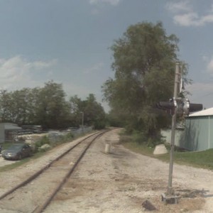 Duck Rd crossing looking north toward Blue Ridge Extension. Previously, a steel trestle crossed over Blue Ridge Ext, then ducked under the KCS mainlin