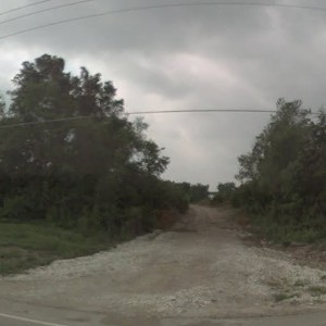 Martha Truman Rd crossing looking south toward the former KCS overpass. This was the end of the Frisco line when the trackage north of the crossing to