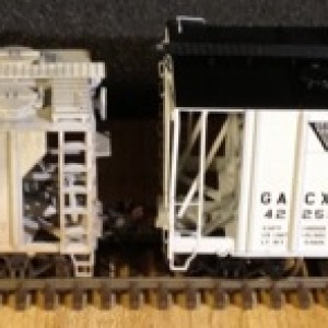 Each of these weathered hoppers is an Atlas Trainman PS-2 Covered Hopper model. I weathered them to simulate cement service. My weathering steps were