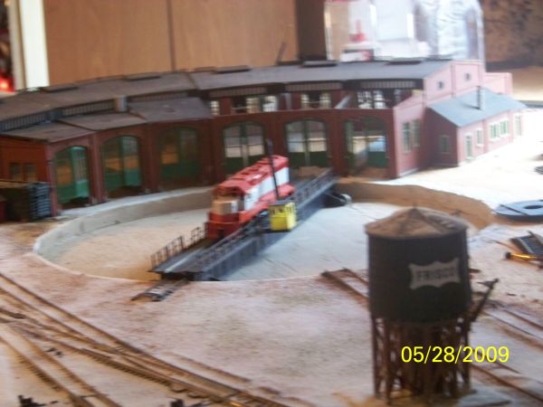 An incomplete FRISCO GP-40 sits on the turntable. The roundhouse is missing some of its roof. But this scene is just to show what has been done so far