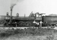 SLSF #658 and Joseph WIlliam Vinson (standing on loco) Springfield Mo ca 1910.jpg