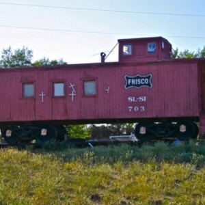 SLSF caboose 703, photographed on July 7, 2009, just outside of Taos, NM, on US Highway 64, en route to Rio Grande Gorge Bridge. Caboose was on privat