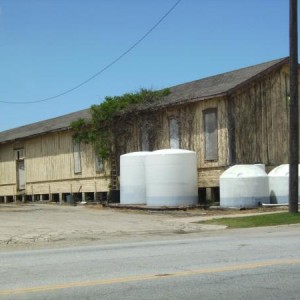 Main Street freight depot. Main Street in the foreground. The short white tanks are 5 and a half feet tall.