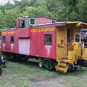 The ES&NA RR Caboose #12153 is an ex-BN #12153. Now retired sitting in RR Yard in the middle of Locomotive #1 & #226.