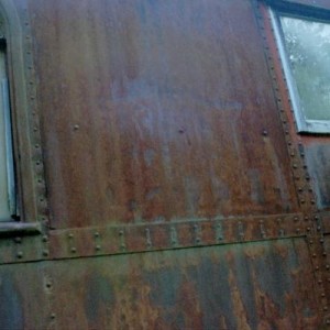 Ex-Rock Island Baggage/Passenger Coach. Faded Rock Island Logo. This Coach is on display at The ES&NA RR Yard.