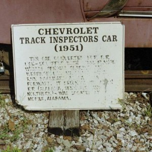 A sign by a Track Inspectors Car read: Chevorlet Track Inspectors Car (1951) This car converted for R.R. use - equipped with steel flange wheels, spec