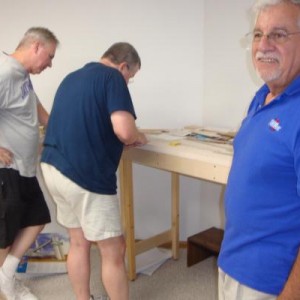 Jim Senese listens to me making a point while Keith Robinson and Rick McClellan work in the background