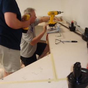 The Weight Train holding down the freshly glued track! Note track gang worker Rascal the dog helping Keith & Rick!