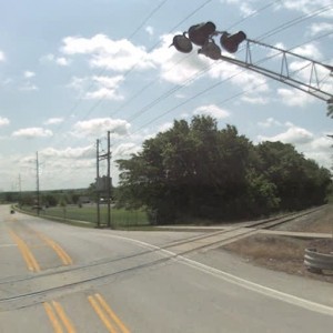 139th Street crossing looking south. to the right of the tracks is Grandboro Arms apartments, while Butcher-Greene Elementary School is on the left si