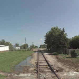 High Grove Rd crossing looking north to Rhodes Ave crossing