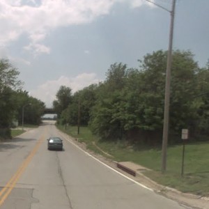 This is Blue Ridge Extension looking west toward Martin City. The trestle on the former Frisco line is gone. The KCS overpass is in the far distance.