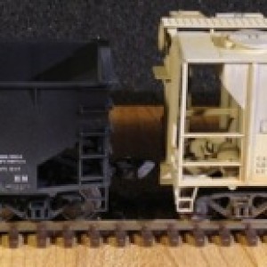 Each of these weathered hoppers is an Atlas Trainman PS-2 Covered Hopper model. I weathered them to simulate cement service. My weathering steps were